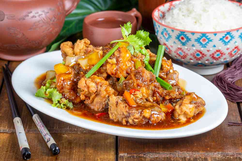 67.RIZ TRAVERS DE PORC AVEC SAUCE AU SEL ET POIVRE